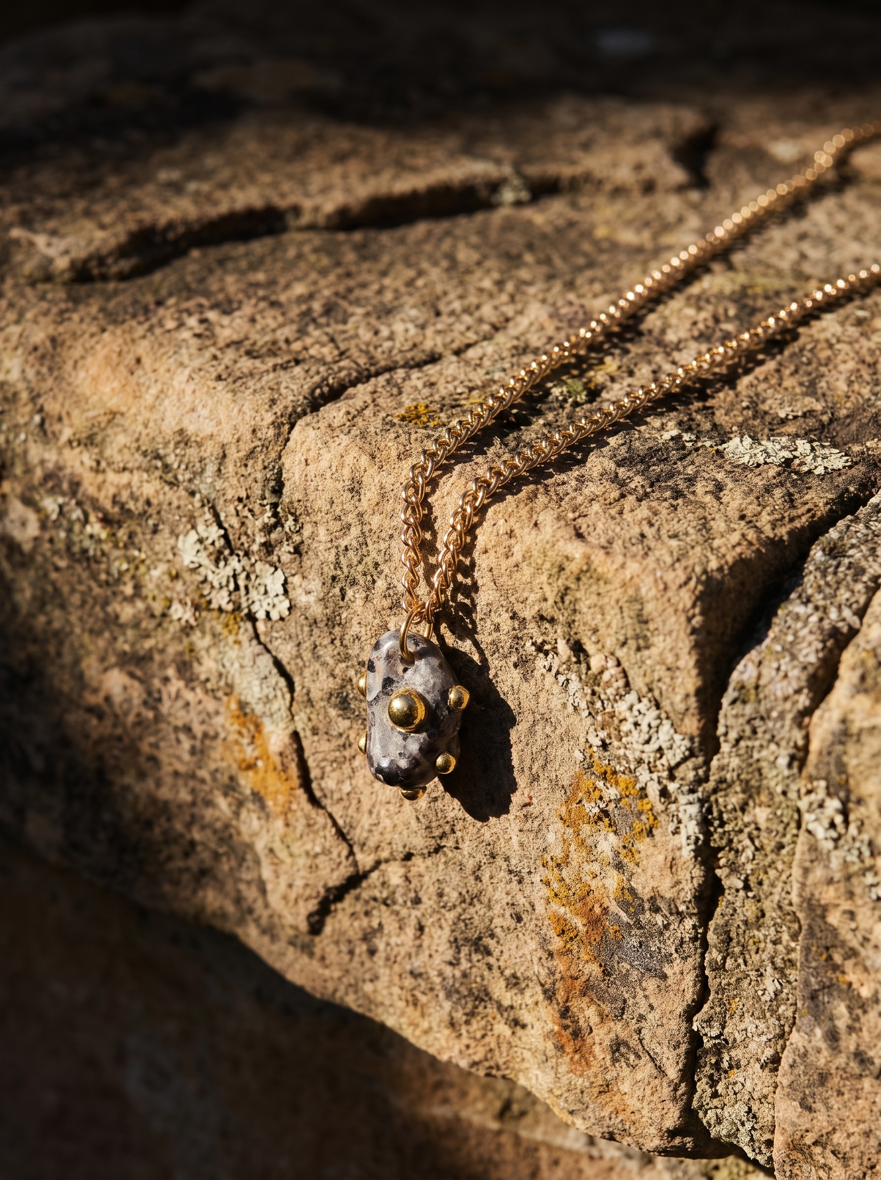 A Tiny Talisman resting on stone